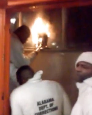 This still image taken from video shot by an inmate from the Holman Correctional Facility shows a prison riot on north of Atmore, Ala., Friday, March 11, 2016.  Department of Corrections spokesman Bob Horton said three emergency response teams were deployed to bring the prison dorm under control. He said the facility is now calm and remains on lockdown Saturday morning. The violence erupted Friday night when an inmate stabbed an officer after refusing to obey the officer’s instructions.
