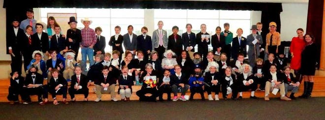 Athens Academy's third-grade students pose for a photo during the recent Hall of Presidents Wax Museum. Joing the students are teachers Sandra Kellett (left, back row), Ashley Foreman and Miriam Metcalf (far right), and assistant teacher Mike Radford (left, back row). Submitted photo.
