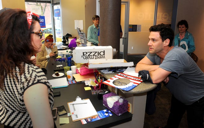 Actor Justin Bartha, right, visits with campaign volunteer Felicia Rateliff during a stop at Vermont Sen. Bernie Sanders’ local Democratic presidential campaign headquarters, 15 N. Tenth St. Volunteers posed for photos with Bartha, who was part of the campaign’s get-out-the-vote efforts ahead of Tuesday’s presidential primary