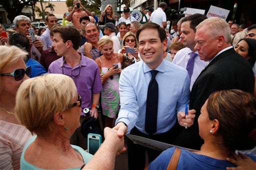 In this March 11, 2016, photo, Republican presidential candidate, Sen. Marco Rubio, R-Fla. greets supporters in Naples, Fla. After a brutal run of results in his campaign for president, Rubio's political future will be decided by voters in his home state of Florida on March 15. Given the change to breathe new life into his White House bid, they may instead deliver a loss staggering enough to push him out of politics. (AP Photo/Paul Sancya)