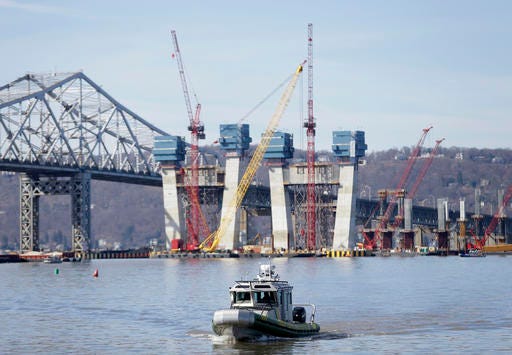 A New York State Police boat passes near the site of a fatal collision in the water underneath the Tappan Zee Bridge in Tarrytown, N.Y., Saturday, March 12, 2016. A tugboat crashed into a barge on the Hudson River north of New York City early Saturday killing at least one crew member and leaving two still missing. (AP Photo/Seth Wenig)