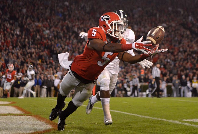 Georgia wide receiver Terry Godwin (5) dives to catch a pass for a touchdown as Georgia takes on Georgia Southern at Sanford Stadium on Saturday, Nov. 21, 2015 in Athens, Ga. (Richard Hamm/Staff) OnlineAthens / Athens Banner-Herald