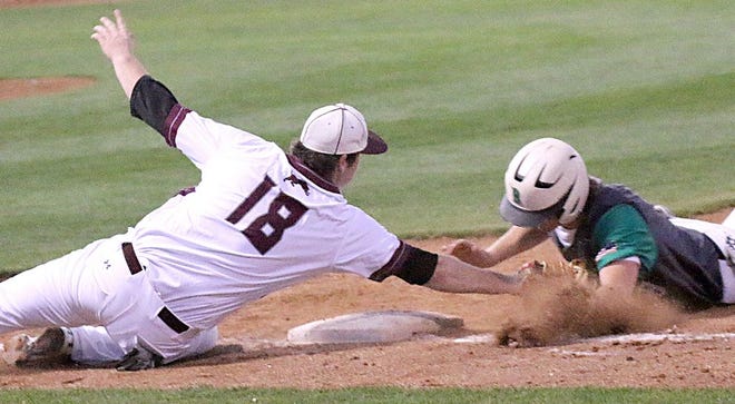 Brownwood first baseman Tristan Chesser (18) tags Bangs' Chance Beck (8) attempting to dive back to the bag during the Lions' 7-2 victory Monday night at Morris Southall Field.