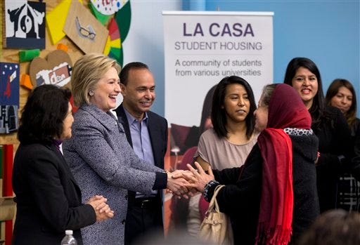 Democratic presidential candidate Hillary Clinton greets a woman at an immigration round table at The Resurrection Project at La Casa in the Pilsen neighborhood of Chicago on Monday, March 14, 2016. With Clinton at left is labor leader Dolores Huerta and at her right is Rep. Luis Gutierrez, D-Ill.