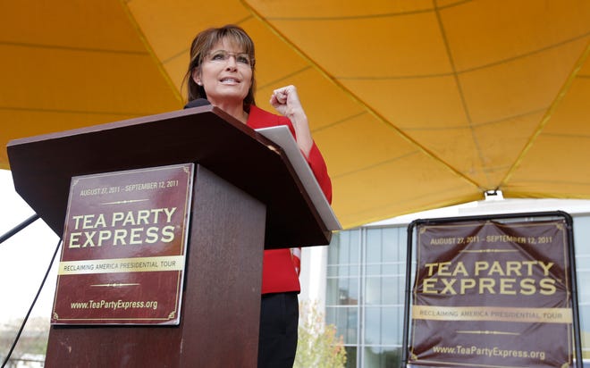 In this Sept, 5, 2011, file photo, former vice presidential candidate and Alaska Gov. Sarah Palin speaks at a Tea Party Express Rally in Manchester, N.H. Donald Trump's presidential campaign says that Todd Palin, husband of Sarah Palin, has been "in a bad snow machine accident" Sunday night and is hospitalized.