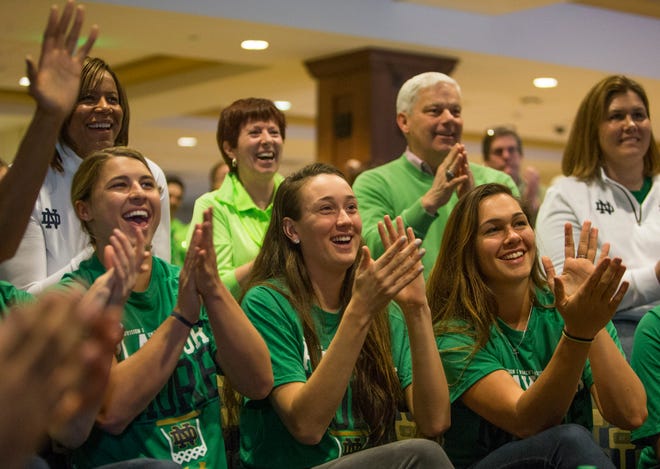 Notre Dame women's basketball players Hannah Huffman, left, Michaela Mabrey, center, and Kathryn Westbeld react as their placement as a No. 1 seed in the NCAA tournament is announced during the ESPN selection show on Monday, March 14, 2016, in South Bend, Ind.