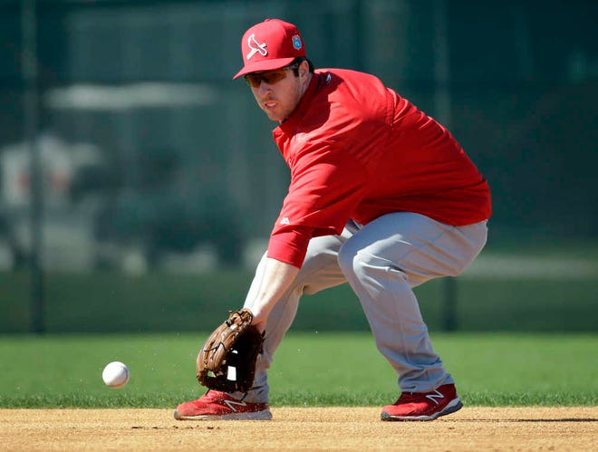 St. Louis Cardinals' Jedd Gyorko handles a grounder during spring training on Feb. 25 in Jupiter. Even before Jhonny Peralta was sidelined with a thumb injury, Gyorko had been preparing to be a starter for the Cardinals. (AP Photo/Jeff Roberson)