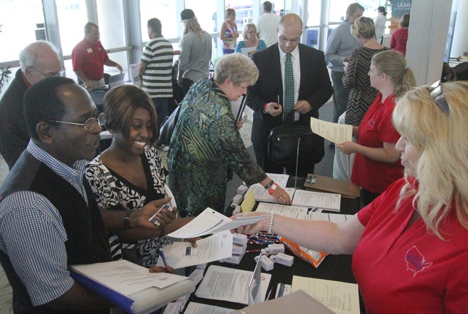 Job seekers meet and greet employers on Tuesday during the Mega Job Fair at the News-Journal Center in Daytona Beach. News-Journal/David Tucker