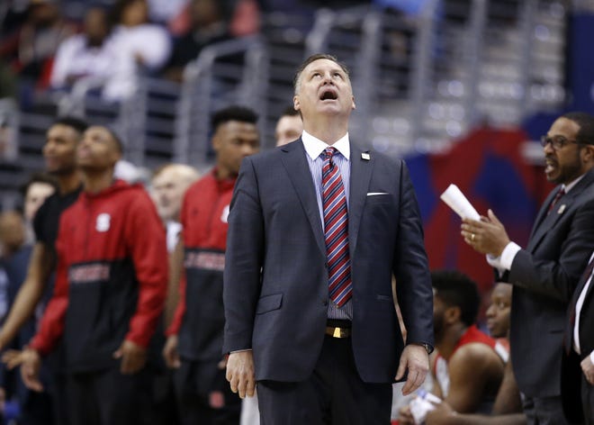 North Carolina State had missed the NCAAs for 15 of 21 seasons when coach Mark Gottfried arrived. His first four teams all went to the tournament and two reached the Sweet 16, but this year's team fell short and lost nine games by seven or fewer points.

 (AP Photo/Alex Brandon)