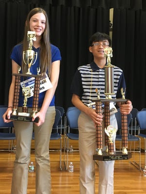 Rexen Venevongsoth, right, won the 2016 Cleveland County Spelling Bee after a 45 minute duel with runner-up Savannah Burns on Tuesday. Joyce Orlando/The Star