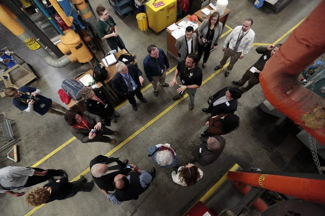 A delegation of political and educational leaders from the Azores are given a tour of the engineering shop at GNB Voc-Tech High School. 

PETER PEREIRA/THE STANDARD-TIMES/SCMG