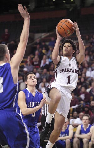 Bishop Stang's Justin Lopes makes a jumper in the early going of the Spartans' Division 3 semifinal win over Bedford. MICHAEL SMITH/STANDARD TIMES SPECIAL/SCMG