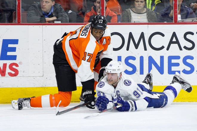 Tampa Bay Lightning center Steven Stamkos (91) looks on after being checked by Philadelphia Flyers right winger Wayne Simmonds (17) during the second period on March 7. The Flyers won 4-2.