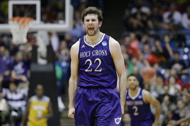 Holy Cross' Robert Champion reacts after hitting a 3-pointer late in the second half of the Crusaders' win over Southern University in a First Four game of the NCAA tournament in Dayton, Ohio.