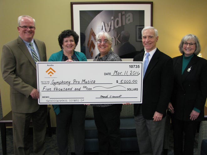 Presenting the check, from left: Mark R. O’Connell, president and CEO of Avidia Bank; Alison Doherty, general manager of Symphony Pro Musica; Margery Goldstein, composer and member of orchestra for Symphony Pro Musica; and Ed Testa and Etta Davis, co-presidents of Symphony Pro Musica.