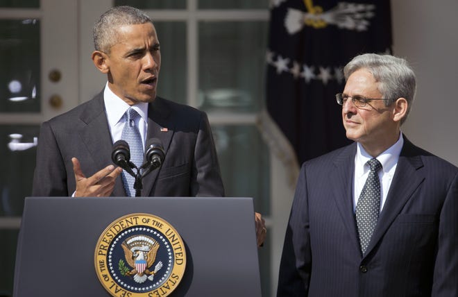 Federal appeals court judge Merrick Garland, right, stands with President Barack Obama as he is introduced as Obama's nominee for the Supreme Court during an announcement in the Rose Garden of the White House, in Washington, Wednesday, March 16, 2016. (AP Photo/Pablo Martinez Monsivais)