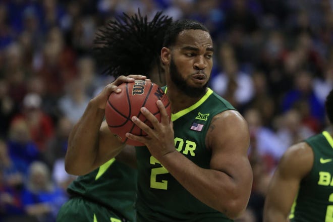 Power forward Rico Gathers, who is 6-8 and 275 pounds, plans to enter the NFL Draft in the spring.