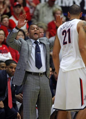 Former Arizona assistant coach Damon Stoudamire, left, is rumored to be the leading candidate in the search for the next Pacific men's basketball head coach. JOHN MILLER/AP FILE PHOTO