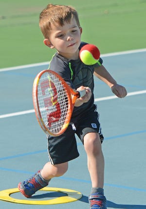 BRIAN D. SANDERFORD • TIMES RECORD Harrison Garlow, 3, hits a ball as he practices at Ben Geren Tennis Center on Tuesday, March 15, 2016. Jheri Buchanan, tennis pro at the center, said he was giving a lesson for the center’s 8 and under group. Also in the group were Harrison’s sister, Ellen, 7, Ethan Barber, 5, and Caden Barber, 3. 
 BRIAN D. SANDERFORD • TIMES RECORD Harrison Garlow, 3, hits as he practices with his sister, Ellen, 7, Ethan Barber, 5, and Caden Barber, 3, right, at Ben Geren Tennis Center on Tuesday, March 15, 2016. Jheri Buchanan, tennis pro at the center, said he was giving a lesson for the center’s 8 and under group. The children were at Ben Geren with their mothers, Sarah Garlow and Beth Barber. 
 BRIAN D. SANDERFORD • TIMES RECORD Harrison Garlow, 3, hits a ball as he practices with his sister, Ellen, 7, Ethan Barber, 5, and Caden Barber, 3, right, at Ben Geren Tennis Center on Tuesday, March 15, 2016. Jheri Buchanan, tennis pro at the center, said he was giving a lesson for the center’s 8 and under group. The children were at Ben Geren with their mothers, Sarah Garlow and Beth Barber.