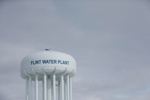 In this Feb. 26, 2016 file photo the Flint Water Plant tower is seen in Flint Mich. Emails obtained by The Associated Press show EPA chief Gina McCarthy warned in September that the Flint water crisis could "get very big very quickly." McCarthy responded Sept. 26 to messages notifying her that the city's water had high levels of lead and that it had been detected in the blood of some children. McCarthy is scheduled to testify Thursday March 17, 2016 before a U.S. House committee looking into the matter. (AP Photo/Paul Sancya File)