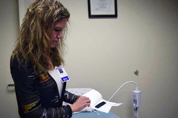Becky O'Neal, coordinator of Northwest Texas Hospital's Sexual Assault Nurse Examiner program, shows a rape kit employed by the nurses who collect physical evidence after sexual assaults and other sex crimes.