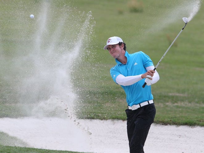 Austen Truslow hits out of a bunker on the sixth hole Thursday at the Ocala Open. Truslow is the co-leader heading into today's final round at Candler Hills.