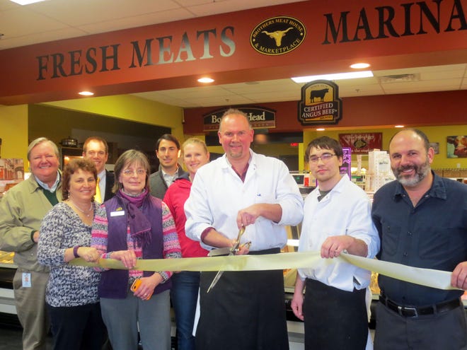 On hand for a ribbon cutting ceremony at Brothers Meat House & Marketplace were, from left, front, Deb Moulton, A Step Up Bookkeeping; Nancy Montville, legal; John Welch, owner; Joe Roberts, butcherís assistant; Derek Najariam, Precision BMW Repair; back, Ed Pastor, Seacoast Media Group; Elliot Evans, Edwards Jones-Epping; Greg Schena, Masiello Group Commercial Real Estate and Lindsey Murphy, Lifevantage. Courtesy photo