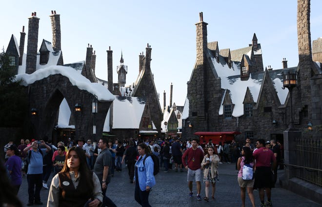 People walk through the village at Universal Studios Hollywood's new Wizarding World of Harry Potter. Katie Falkenberg/Los Angeles Times/TNS