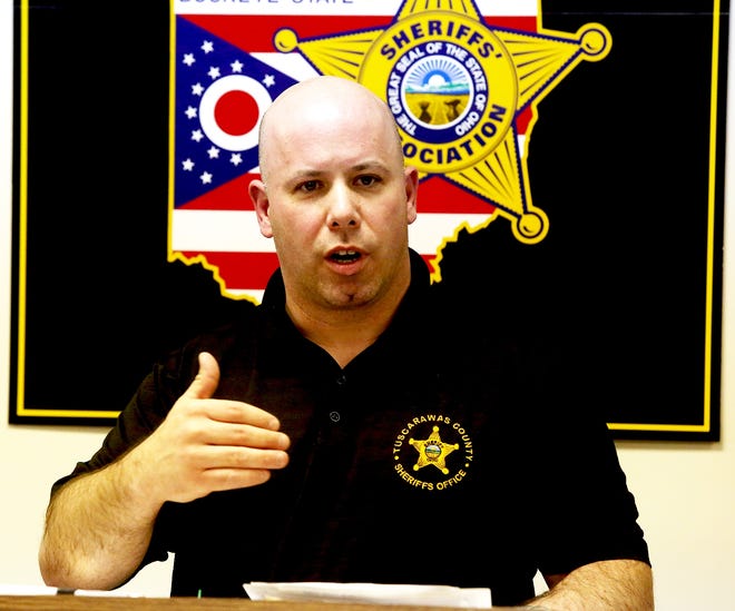 TimesReporter.com/Jim Cummings

Tuscarawas County Sheriff Chief Deputy Orvis Campbell answers questions Thursday afternoon during a press conference regarding the murder in Midvale.