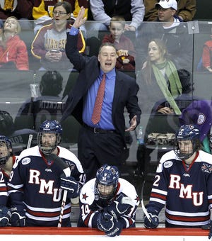 Robert Morris and coach Derek Schooley last appeared in the NCAA Tournament in 2014 (shown above). The Colonials need victories over Army and either Air Force or RIT to return to the Tournament. (AP Photo/Ann Heisenfelt)