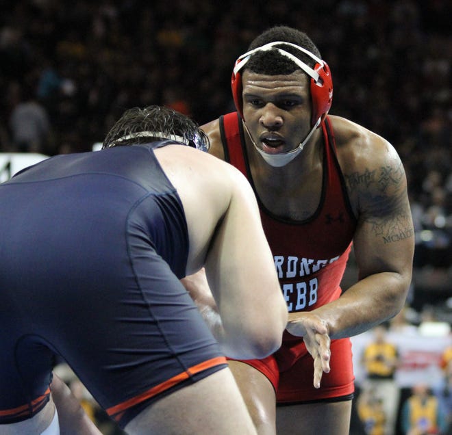 GWU junior heavyweight wrestler Boyce Cornwell, right, tries to find an opening against an opponent at the NCAA Championships at New York's Madison Square Garden. Cornwell went 1-2 in matches at the nationals, all againast Big 10 Conference opponents. (Photo courtesy of GWU Athletics)