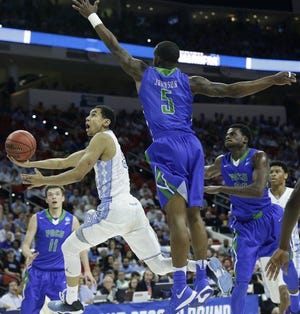 Marcus Paige drives to the basket against Florida Gulf Coast in the Tar Heels' NCAA opener.