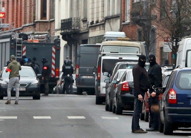 Police at the scene of a security operation in the Brussels suburb of Molenbeek in Brussels, Belgium, March 18, 2016.  (REUTERS/Francois Lenoir)