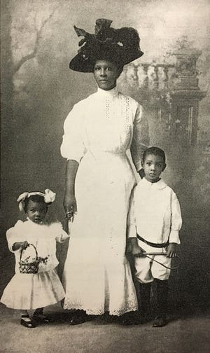 Peoria resident Jessie Wylie poses for a formal family portrait with her children, Minnie, left, and Albert, right, around 1911. Albert is the father of Al Wylie.