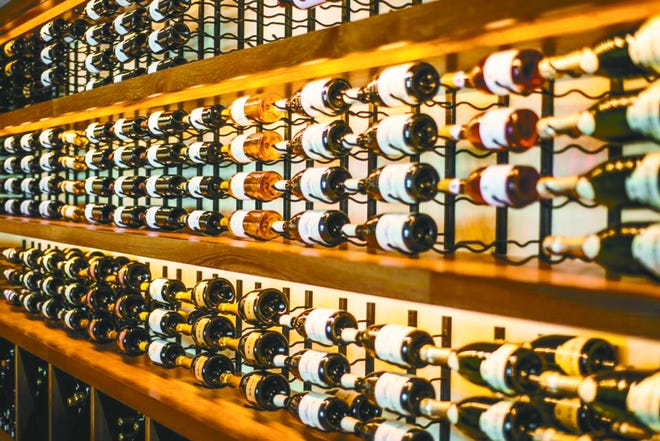 Options for wine storage come in many shapes and sizes, from full room units, above, to smaller shelves, below,  and even stands that can be placed on counters. Ideally, wine should be stored in a cool and humid area.