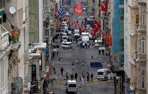 Emergency services at the scene of an explosion, on a street, in Istanbul, Turkey, Saturday, March 19, 2016. An explosion on Istanbul’s main pedestrian shopping street on Saturday has killed a number of people and injured over a dozen others. (AP Photo/Emrah Gurel)