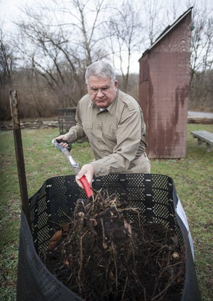 Volunteer compost educator and master composter Steve Callis turns compost in a Presto bin March 9 at the Capen Park demonstration site. Churning compost allows for air to flow through the materials and bacteria to spread. The Presto bin is offered for free at all demonstrations. The next demonstration will be on Earth Day.