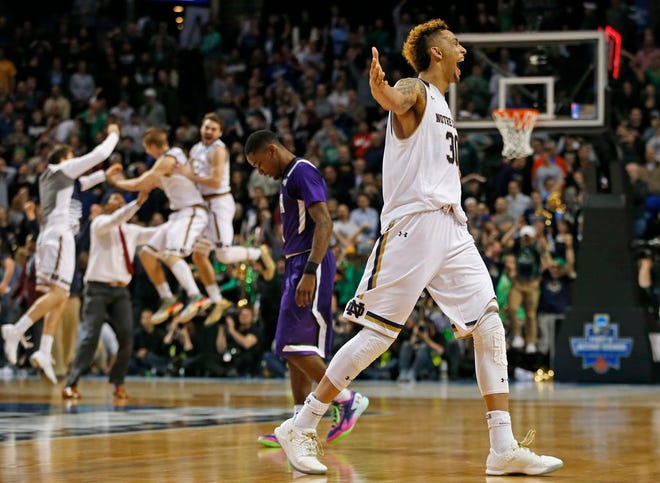 Notre Dame forward Zach Auguste, right, celebrates after Notre Dame defeated Stephen F. Austin 76-75 on a last second shot during the second half of a second-round NCAA men's college basketball tournament game, Sunday, March 20, 2016, in New York. (AP Photo/Kathy Willens)