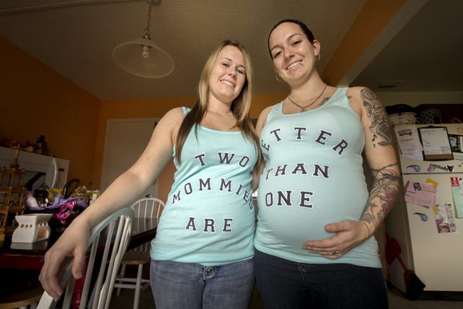Viktoria Gerth-Stephenson, right, and her spouse Rebecca Stephenson, left, are expecting a baby boy at their home in Winter Haven. Feb. 24 2016.