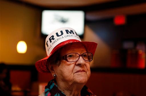 Maria Sanchez, 94, watches the results of GOP presidential candidate Donald Trump being shown on TV at the GOP party at Pembroke Pizza in Virginia Beach, Virginia, on Tuesday, March 1, 2016.