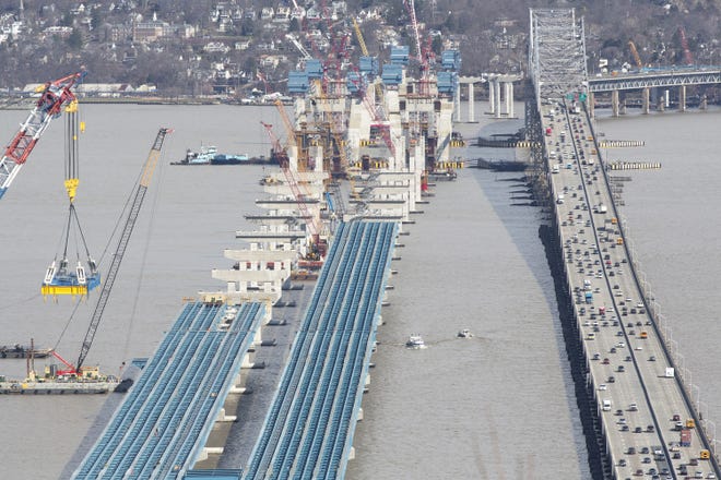 Work continues on the new Tappan Zee Bridge; all-electronic toll collection will begin April 23 on the existing bridge. For more photos of the construction project, go to recordonline.com. ROBERT G. BREESE/TIMES HERALD-RECORD