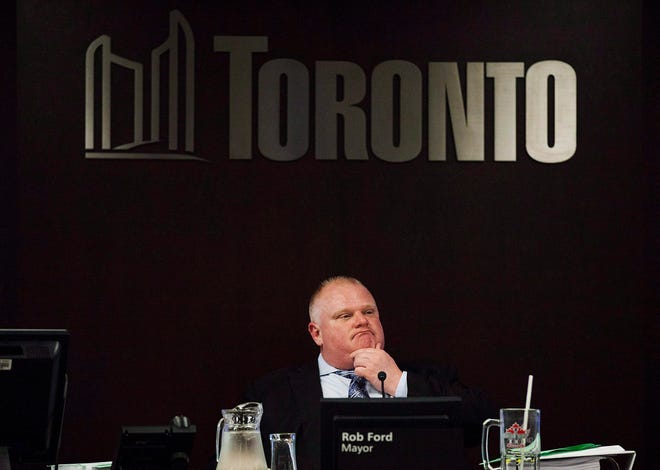 FILE - In this May 28, 2013 file photo, Toronto Mayor Rob Ford attends an executive committee meeting at Toronto City Hall. Ford, whose career crashed in a drug-driven, obscenity-laced debacle, died Tuesday, March 22, 2016 after fighting cancer, his family says. He was 46. (Michelle Siu/The Canadian Press via AP)