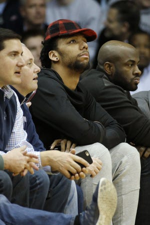 Sixers rookie center Jahlil Okafor watches the first half of the March 1 Villanova-DePaul game.