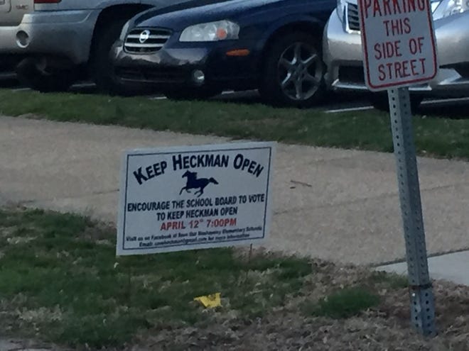 Supporters have been going around the Langhorne and Middletown to revise the "Keep Heckman Open" signs. They put the new date in red for when the Neshaminy school board will vote on whether to close the elementary school.