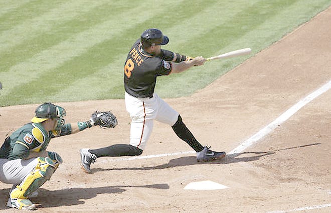 San Francisco Giant Hunter Pence, a former Schenectady Mohawk, hits a home run against the Oakland Athletics during the fourth inning of Monday's spring training game in Scottsdale, Arizona. 

AP Photo/Jeff Chiu