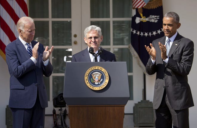 Federal appeals court judge Merrick Garland receives applauds from President Barack Obama and Vice President Joe Biden as he is introduced Wednesday as Obama's nominee for the Supreme Court.