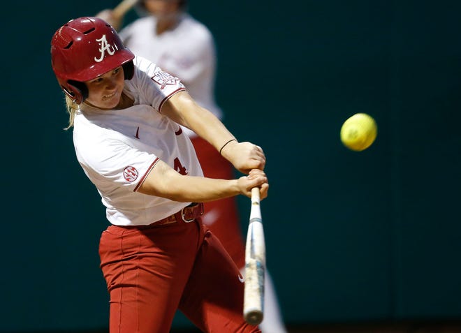 Reagan Dykes hits a home run to right-center field during the Crimson Tide's game with Alcorn State in Rhoads Stadium on Tuesday. Staff Photo/Gary Cosby Jr.
