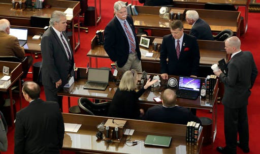 North Carolina lawmakers gather on the House floor for a special session Wednesday, March 23, 2016 in Raleigh, N.C. to consider stopping a new Charlotte ordinance set to take effect April 1 that gives protections to transgender people to use the restroom of their gender identity. (AP Photo/Gerry Broome)
