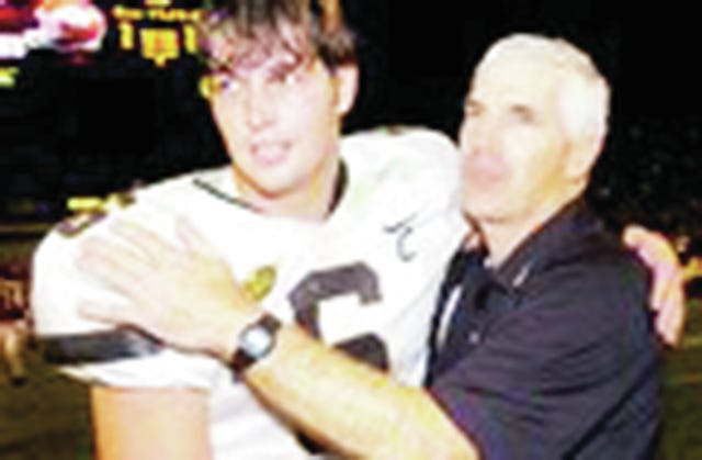 Vanderbilt Coach Bobby Johnson congratulates quarterback Jay Cutler following the Commodores' win over Arkansas in 2006.