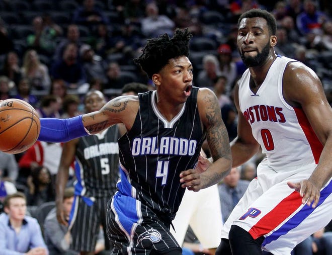 Orlando Magic's Elfrid Payton (4) drives to the basket against Detroit Pistons’ Andre Drummond (0) during the second half of an NBA basketball game Wednesday, March 23, 2016, in Auburn Hills, Mich. The Pistons defeated the Magic 118-102. (AP Photo/Duane Burleson)